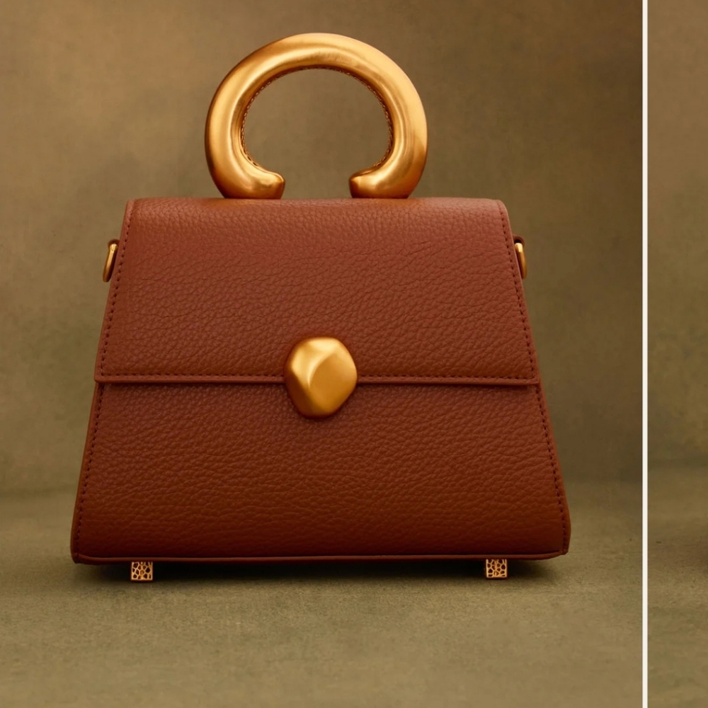 Elegant Khoi Brown/Rust  Handbag with Gold Accents.  BOX INCLUDED